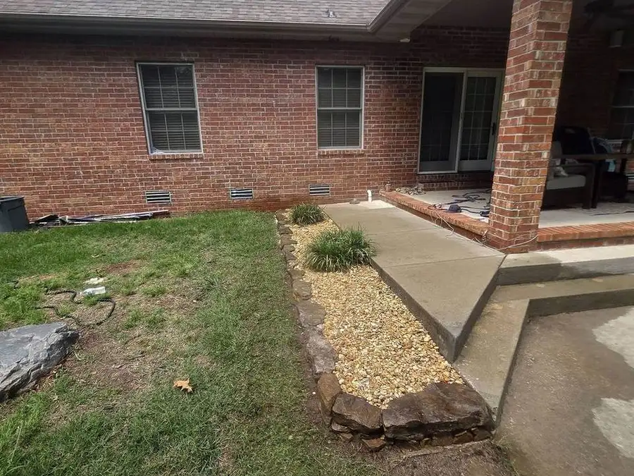 Planting bed running the length of a brick house
