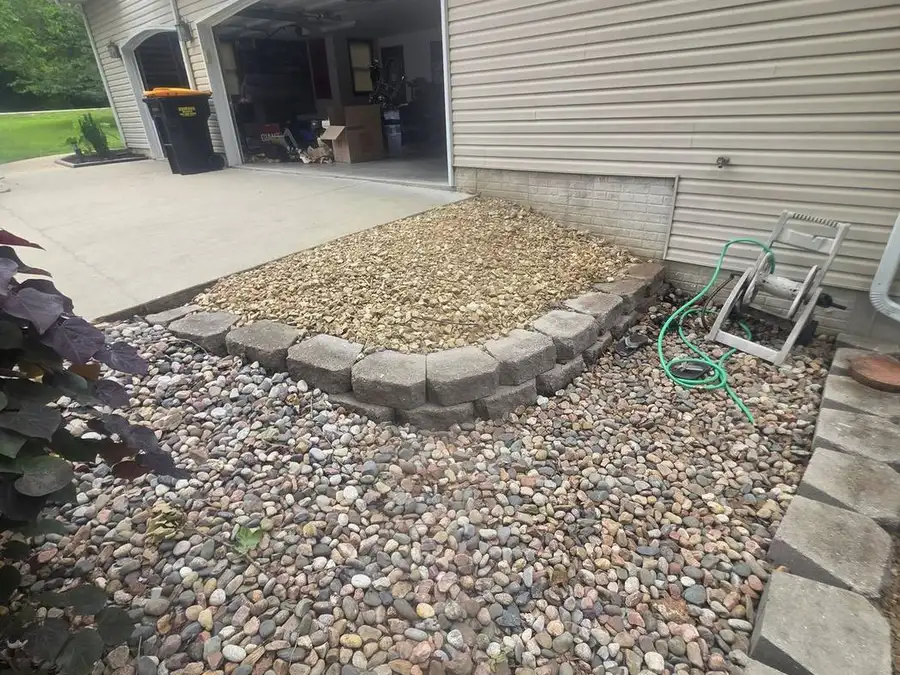 Gravel walk bed beside a house