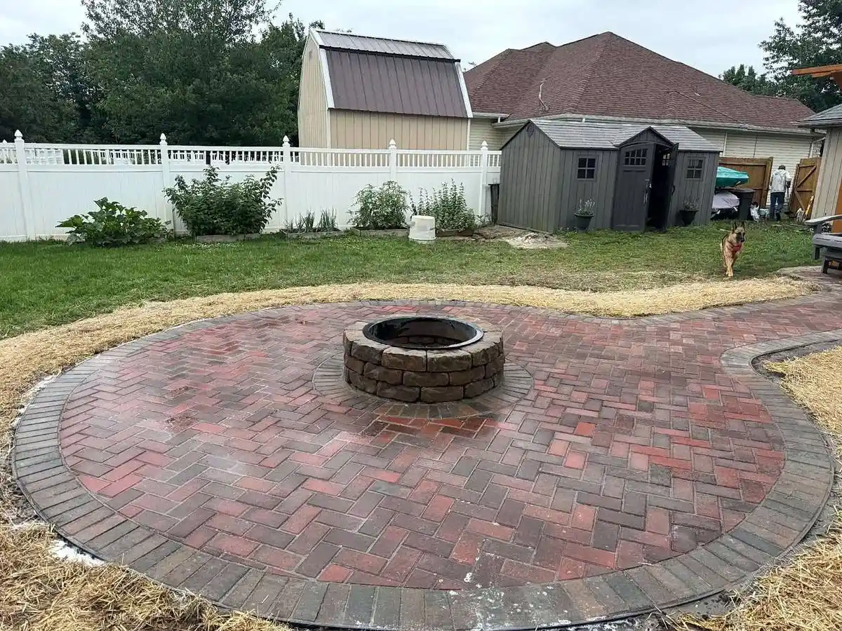 A stone fire pit and graded lawn on a Strafford acreage