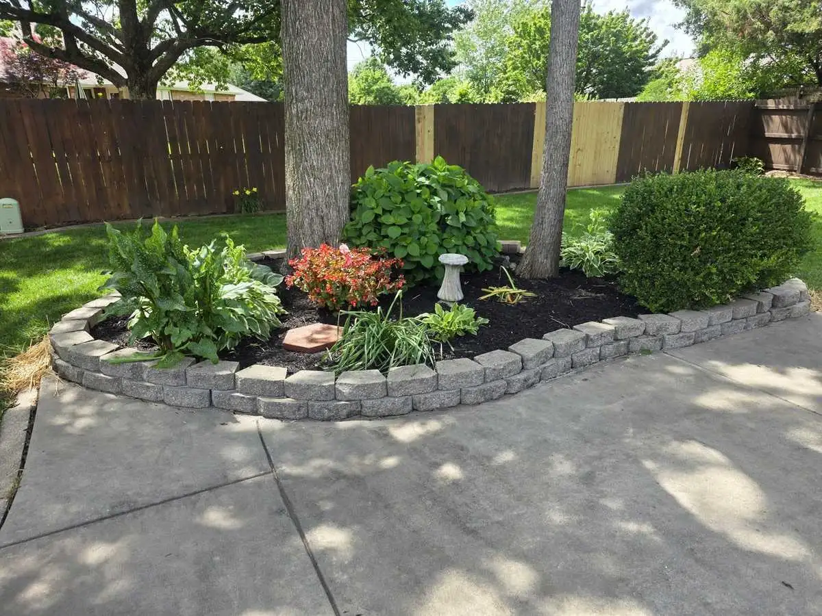 Stone-bordered landscape bed