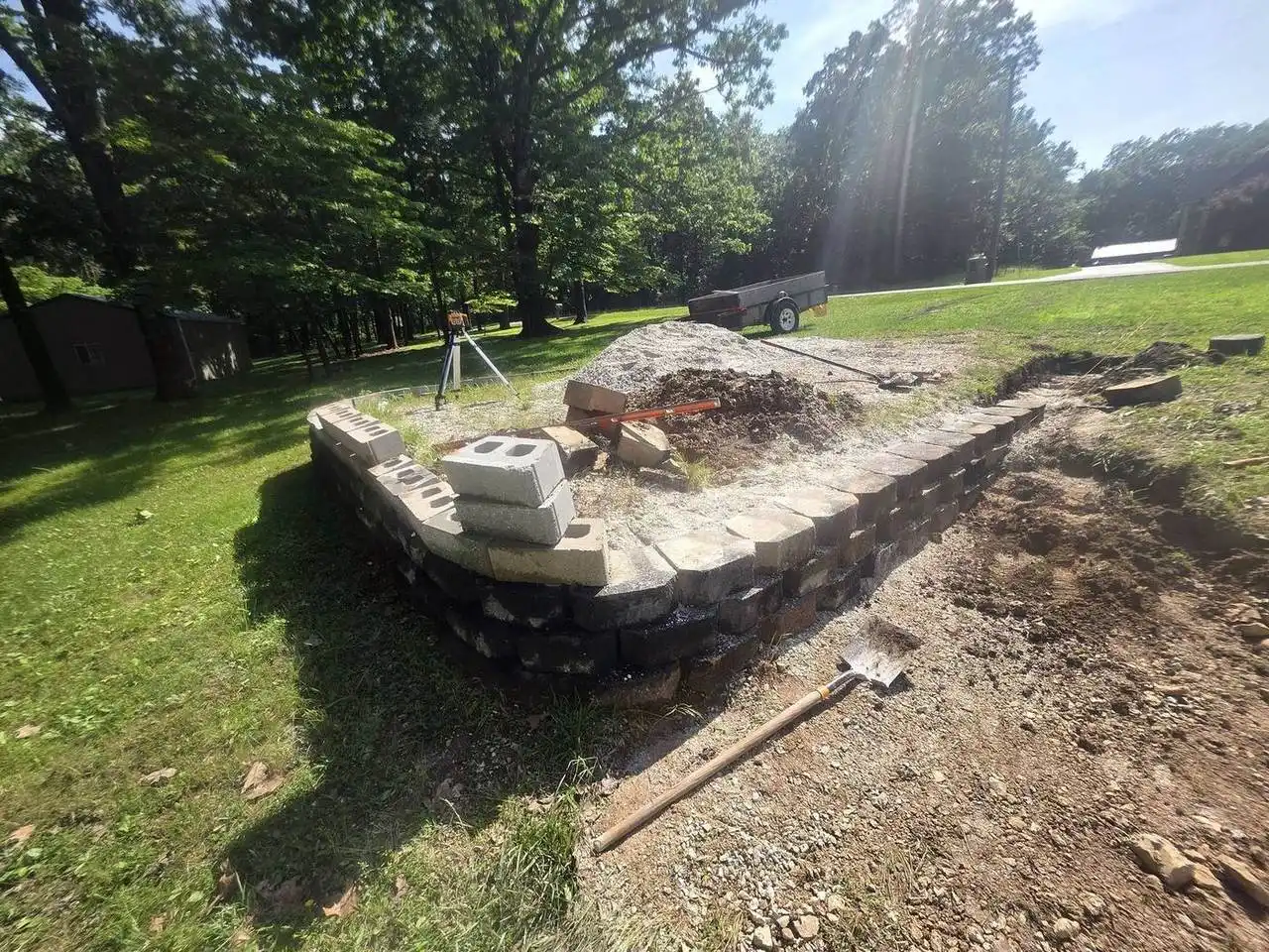 A laser level on a retaining-wall course during construction