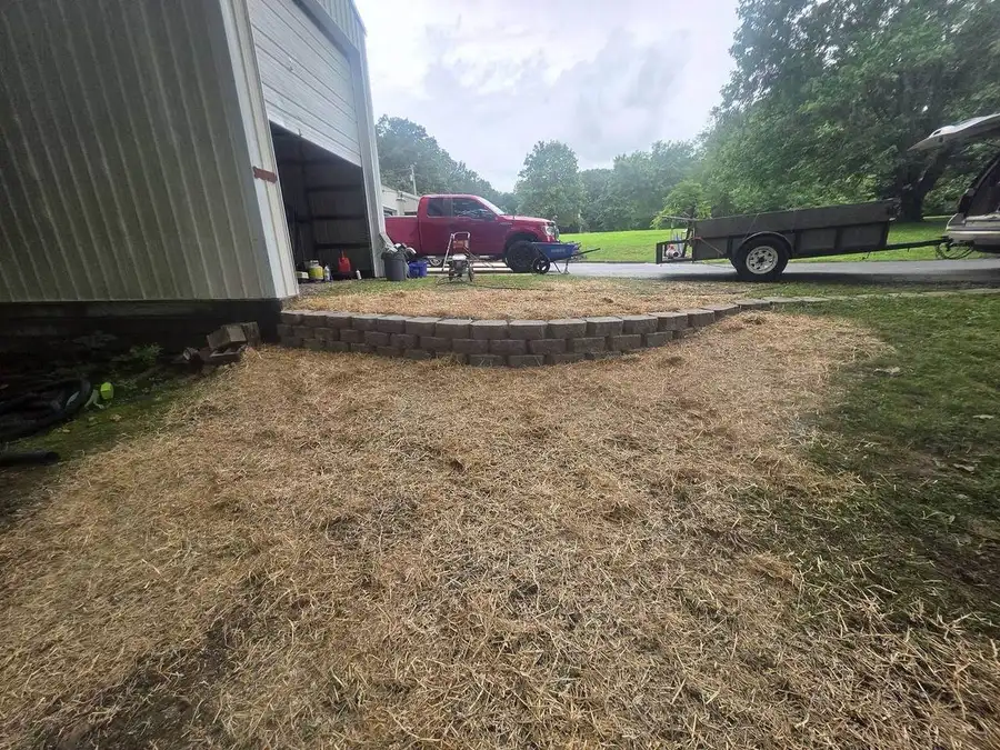 Straw spread across a freshly seeded lot